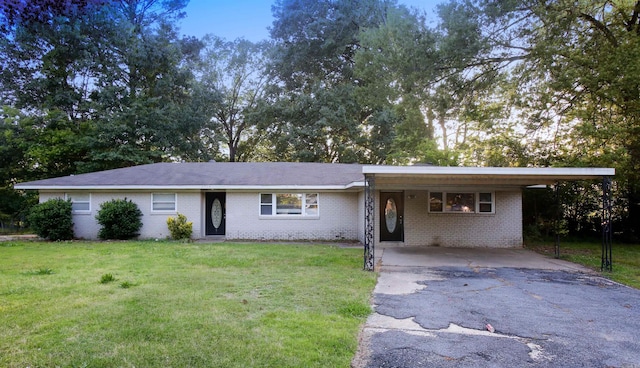 6914 Juniper Rd, Little Rock, AR 72209 - ranch-style home featuring asphalt driveway, brick siding, a front lawn, and a carport