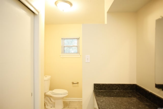 6914 Juniper Rd, Little Rock, AR 72209 - bathroom with toilet, tile patterned flooring, and baseboards