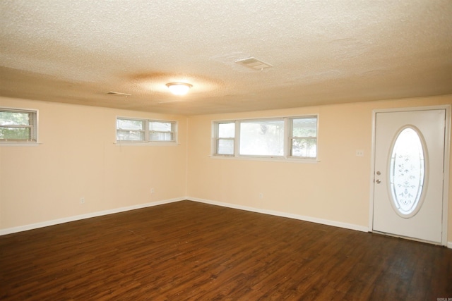 6914 Juniper Rd, Little Rock, AR 72209 - entrance foyer with a textured ceiling, dark wood finished floors, and baseboards