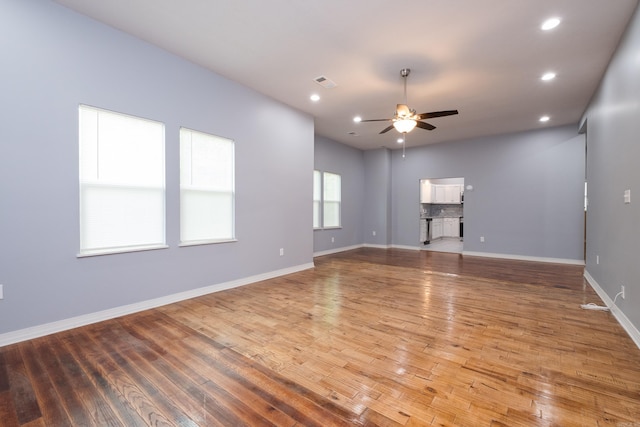1407 Hanger St, Little Rock, AR 72202 - spare room featuring a ceiling fan, light wood-type flooring, baseboards, and recessed lighting