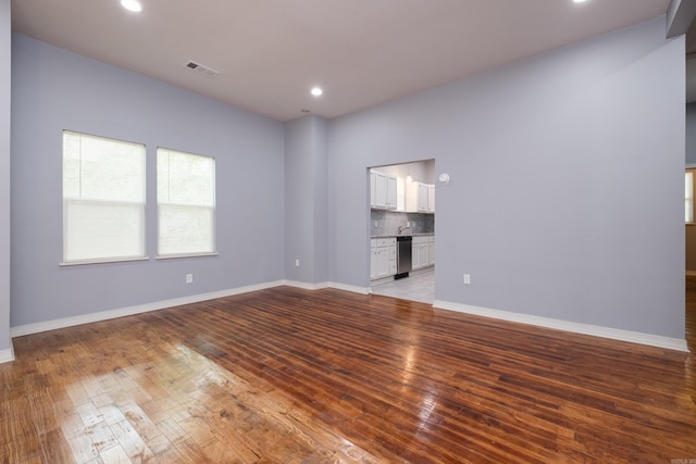 1407 Hanger St, Little Rock, AR 72202 - spare room featuring light wood finished floors, recessed lighting, and baseboards