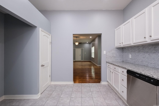 1407 Hanger St, Little Rock, AR 72202 - kitchen with dishwasher, backsplash, white cabinetry, ceiling fan, and light stone counters