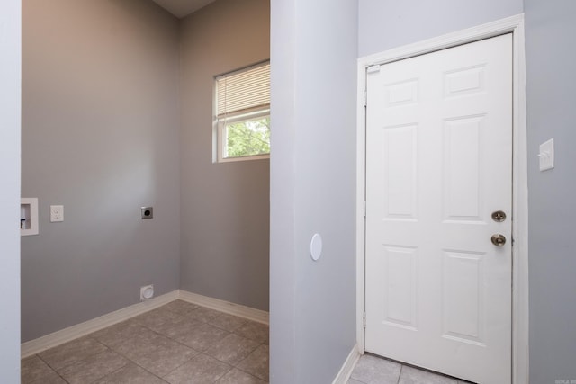 1407 Hanger St, Little Rock, AR 72202 - washroom featuring hookup for an electric dryer, baseboards, and light tile patterned floors