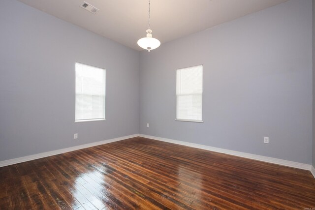 1407 Hanger St, Little Rock, AR 72202 - spare room featuring healthy amount of natural light, dark wood-style floors, and baseboards