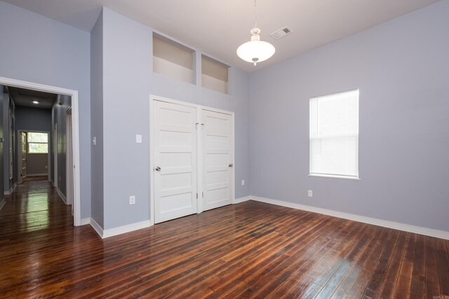 1407 Hanger St, Little Rock, AR 72202 - unfurnished bedroom featuring wood-type flooring, baseboards, and a closet
