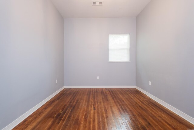 1407 Hanger St, Little Rock, AR 72202 - spare room with dark wood-style flooring and baseboards