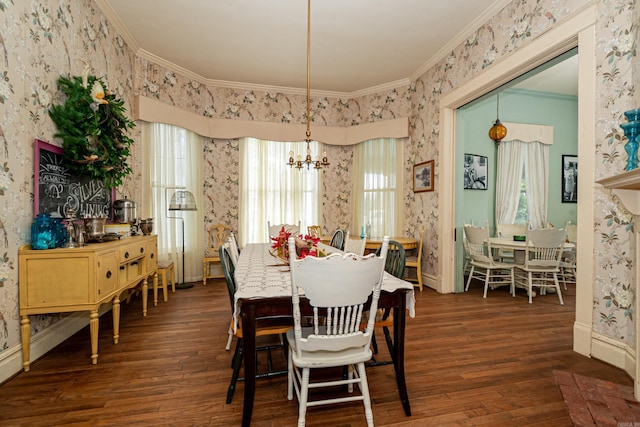 344 S Main St, Monticello, AR 71655 - dining space featuring wallpapered walls, ornamental molding, wood finished floors, a chandelier, and baseboards