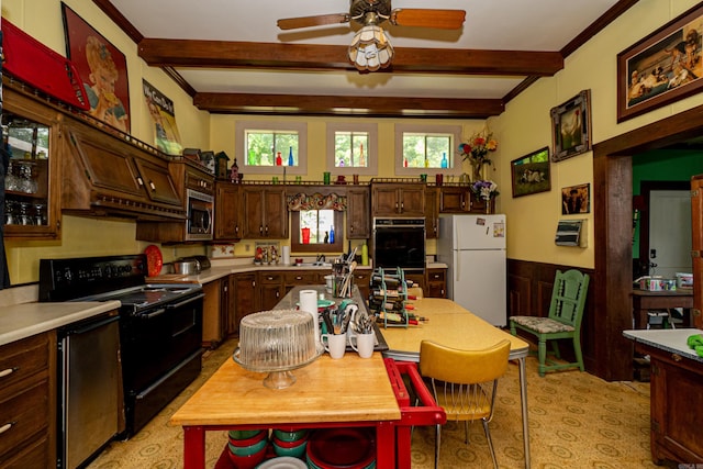 344 S Main St, Monticello, AR 71655 - kitchen featuring black appliances, beamed ceiling, light countertops, ceiling fan, and plenty of natural light