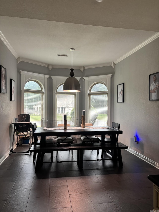 3117 Stonehenge Dr, Searcy, AR 72143 - dining space with crown molding, plenty of natural light, and baseboards