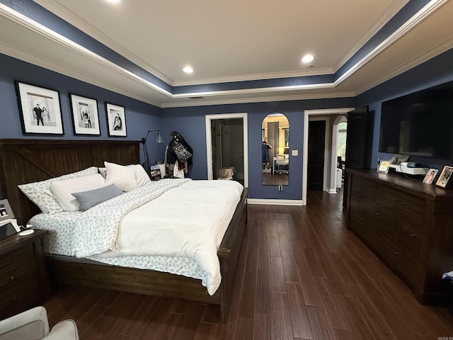 3117 Stonehenge Dr, Searcy, AR 72143 - bedroom with arched walkways, a raised ceiling, dark wood-style floors, baseboards, and crown molding