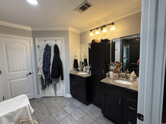3117 Stonehenge Dr, Searcy, AR 72143 - bathroom featuring two vanities and ornamental molding