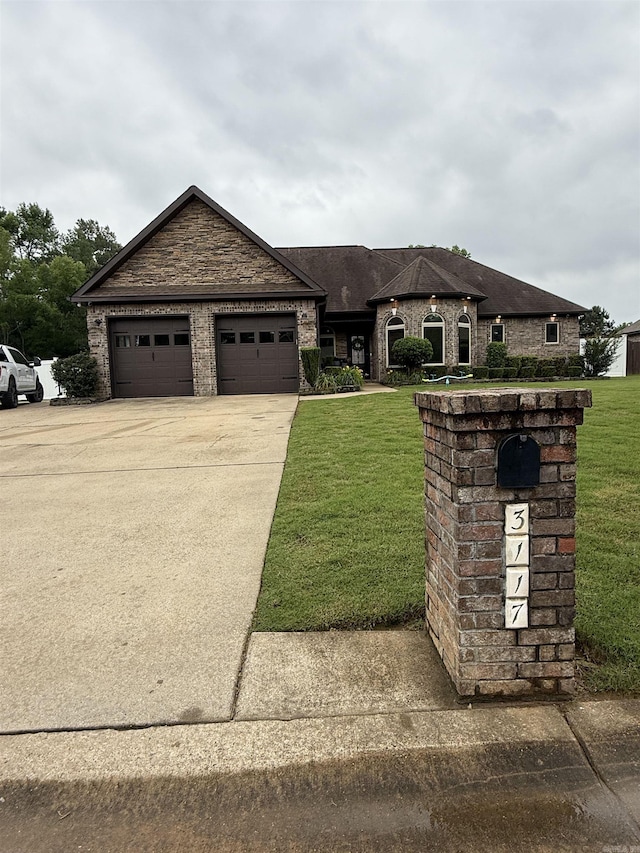 3117 Stonehenge Dr, Searcy, AR 72143 - view of front facade featuring a front yard, a garage, and driveway