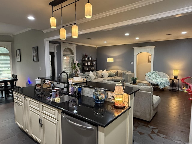 3117 Stonehenge Dr, Searcy, AR 72143 - kitchen with open floor plan, a sink, dark countertops, a kitchen island with sink, and ornamental molding