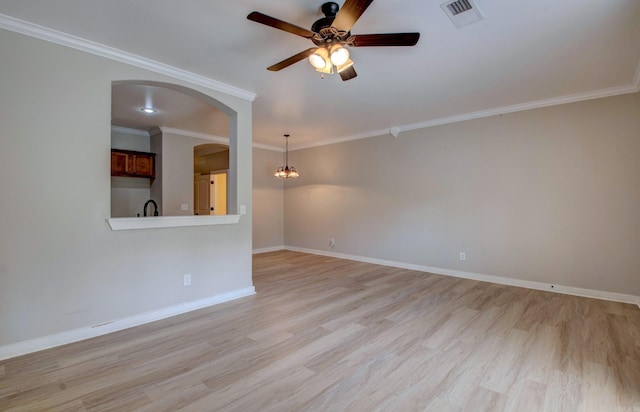 106 Venezia Ln, Maumelle, AR 72113 - spare room with ceiling fan, light wood-style floors, a chandelier, baseboards, and ornamental molding
