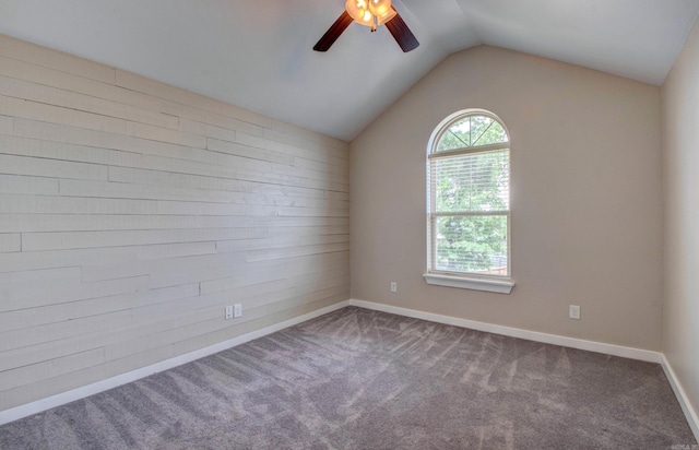 106 Venezia Ln, Maumelle, AR 72113 - carpeted empty room with ceiling fan, lofted ceiling, baseboards, and wooden walls
