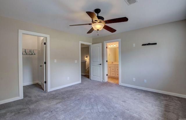 106 Venezia Ln, Maumelle, AR 72113 - unfurnished bedroom with a spacious closet, light carpet, and baseboards