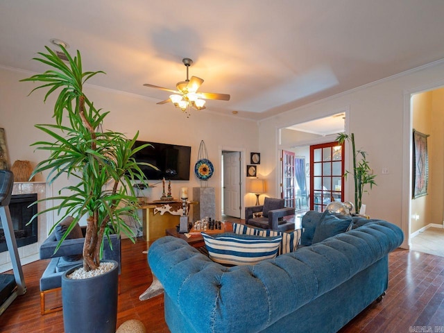 14 Woodridge Dr, Little Rock, AR 72204 - living area featuring crown molding, a ceiling fan, wood finished floors, a fireplace, and baseboards