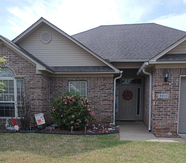 3015 Longmeadow Dr, Bryant, AR 72022 - view of front facade with brick siding, a shingled roof, and a front yard