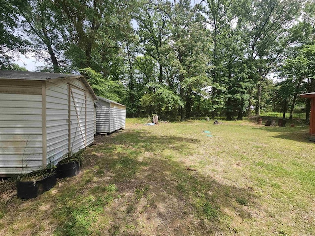 11806 Veronica, North Little Rock, AR 72118 - view of grassy yard featuring an outdoor structure