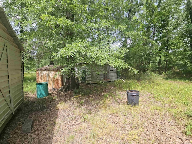 11806 Veronica, North Little Rock, AR 72118 - view of yard with an outbuilding and a storage unit