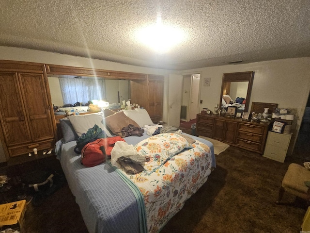 11806 Veronica, North Little Rock, AR 72118 - bedroom featuring a textured ceiling and dark colored carpet