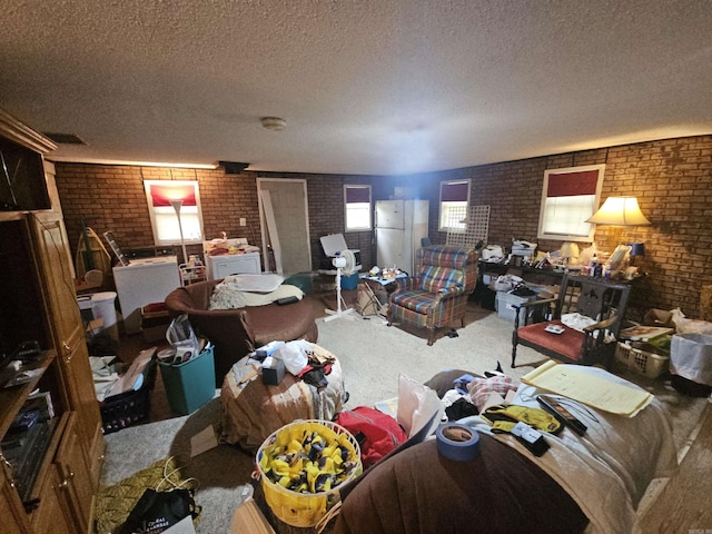 11806 Veronica, North Little Rock, AR 72118 - living area featuring brick wall, a textured ceiling, and carpet floors