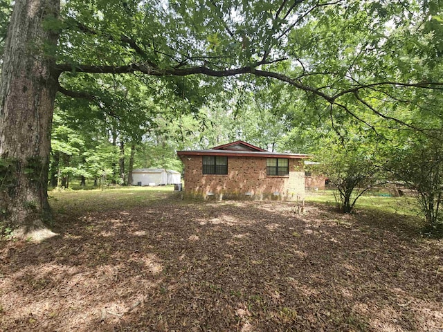 11806 Veronica, North Little Rock, AR 72118 - view of yard featuring a view of trees