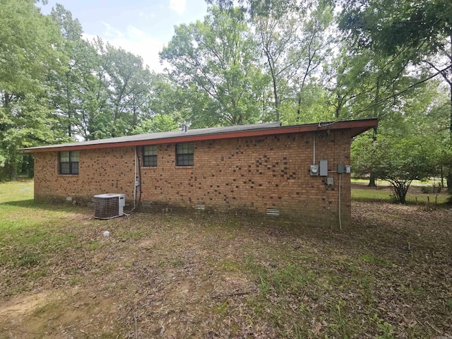 11806 Veronica, North Little Rock, AR 72118 - view of side of home featuring crawl space, central AC unit, and brick siding