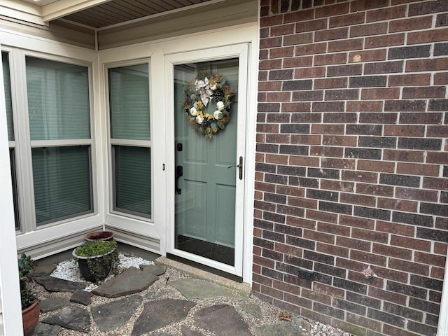 7306 Dakota Dr, North Little Rock, AR 72116 - doorway to property featuring brick siding