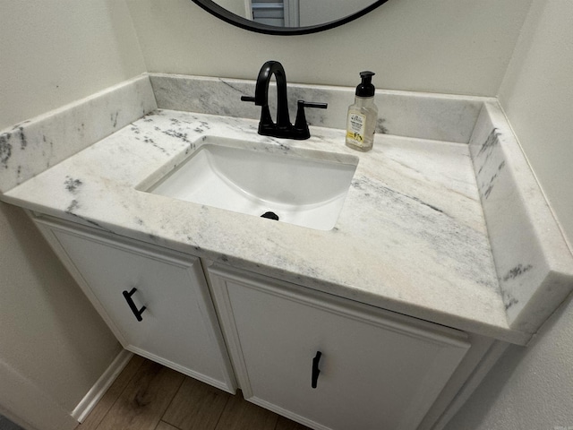 7306 Dakota Dr, North Little Rock, AR 72116 - bathroom with vanity and wood finished floors