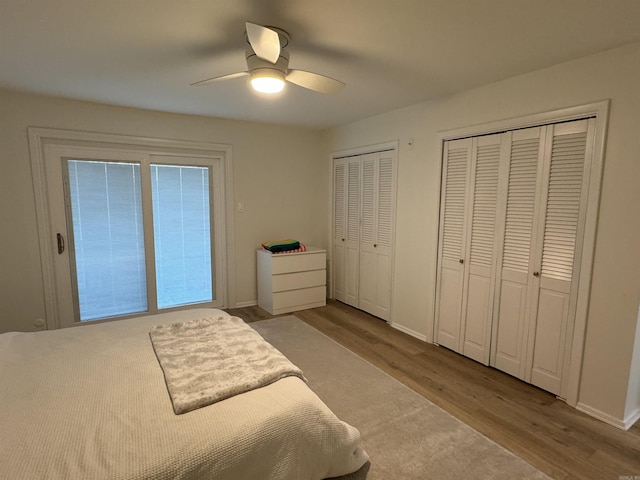 7306 Dakota Dr, North Little Rock, AR 72116 - bedroom featuring multiple closets, wood finished floors, baseboards, and ceiling fan