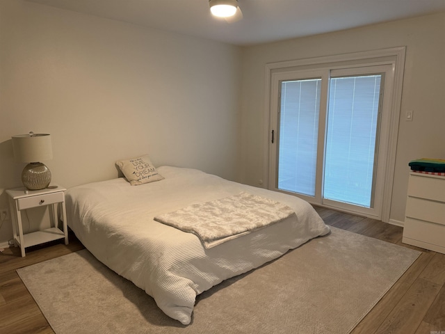 7306 Dakota Dr, North Little Rock, AR 72116 - bedroom featuring wood finished floors and baseboards