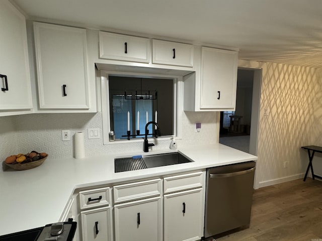 7306 Dakota Dr, North Little Rock, AR 72116 - kitchen with dishwasher, a sink, white cabinets, and light countertops