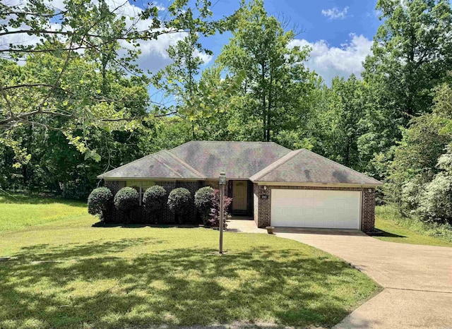1041 Slatecreek Way, Lonsdale, AR 72087 - ranch-style house with a garage, driveway, a front lawn, and brick siding