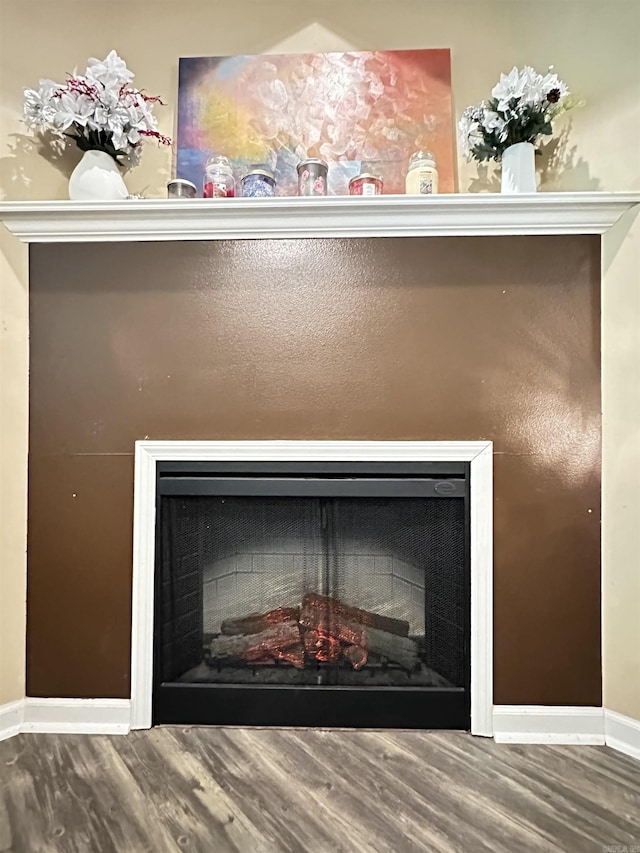 1041 Slatecreek Way, Lonsdale, AR 72087 - detailed view of a fireplace, wood finished floors, and baseboards