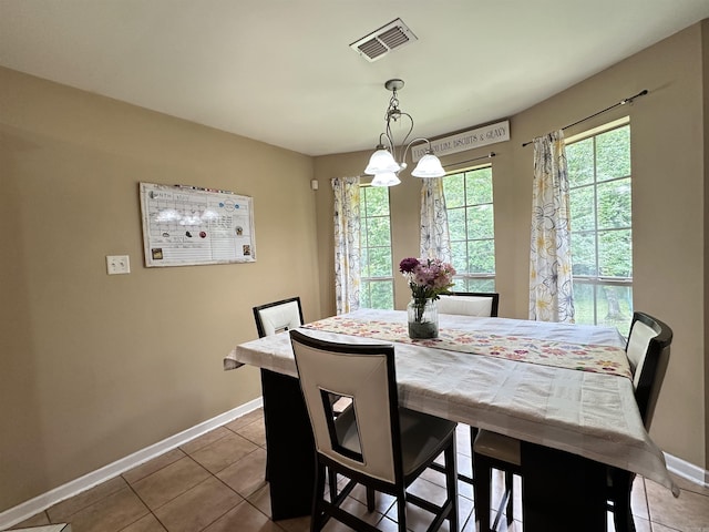 1041 Slatecreek Way, Lonsdale, AR 72087 - tiled dining space featuring baseboards and a chandelier