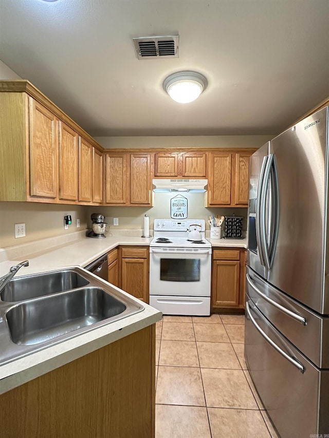 1041 Slatecreek Way, Lonsdale, AR 72087 - kitchen with appliances with stainless steel finishes, a sink, under cabinet range hood, light tile patterned flooring, and light countertops