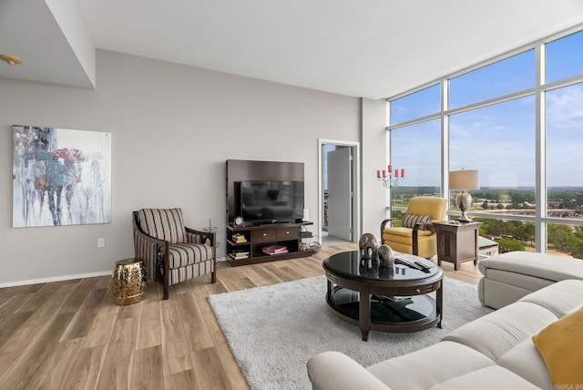 300 E Third # 1302, Little Rock, AR 72201 - living area featuring wood finished floors and floor to ceiling windows