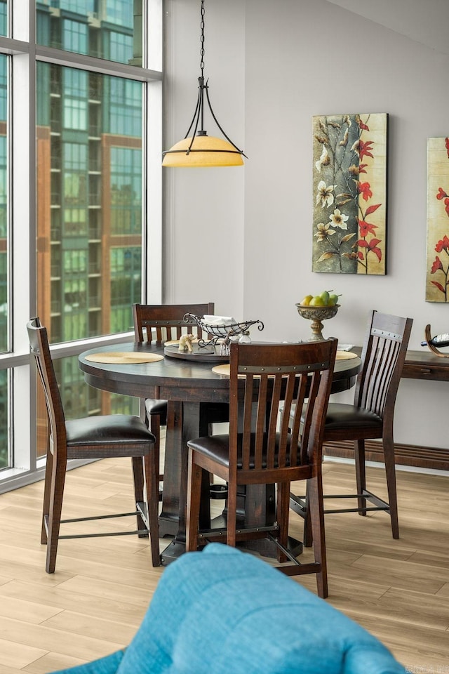 300 E Third # 1302, Little Rock, AR 72201 - dining area with wood finished floors and healthy amount of natural light