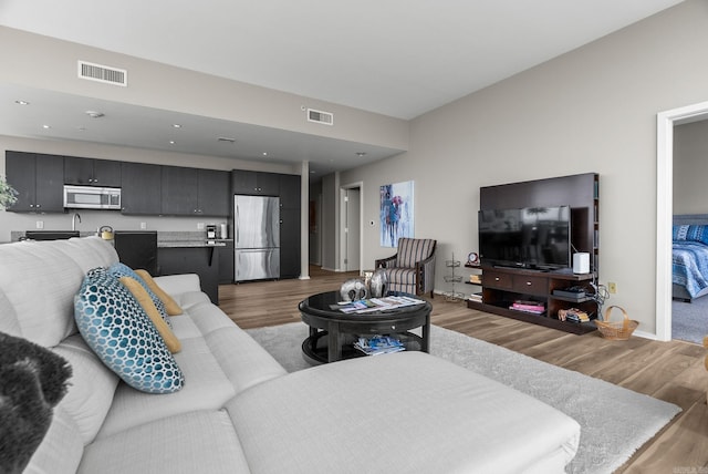 300 E Third # 1302, Little Rock, AR 72201 - living room with light wood finished floors and baseboards