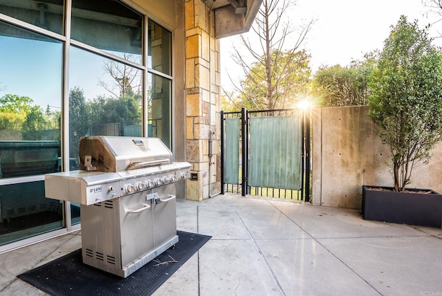 300 E Third # 1302, Little Rock, AR 72201 - view of patio with grilling area, fence, and a gate