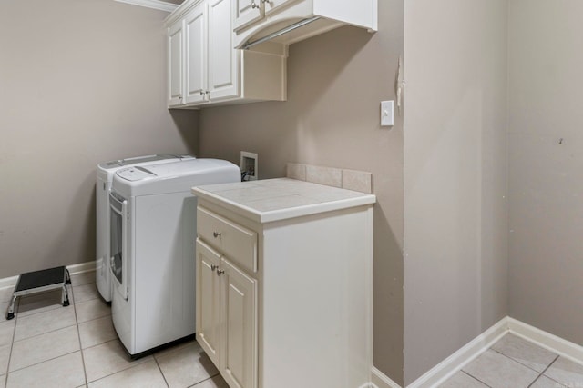 223 Maranes Cir, Maumelle, AR 72113 - clothes washing area with cabinet space, separate washer and dryer, light tile patterned flooring, and baseboards