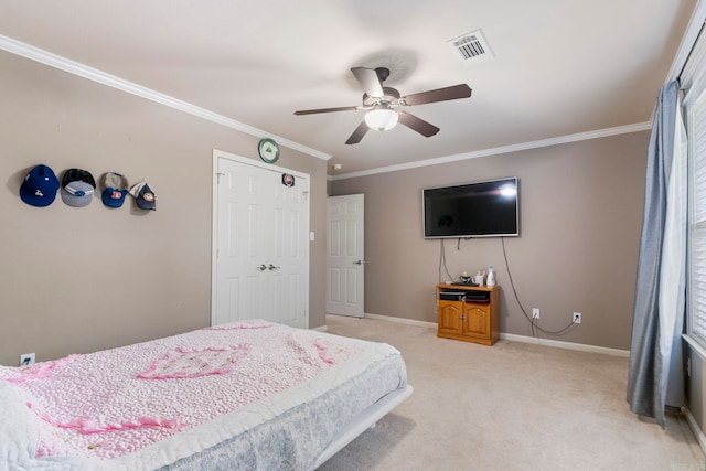 223 Maranes Cir, Maumelle, AR 72113 - bedroom with light colored carpet, baseboards, crown molding, a ceiling fan, and a closet