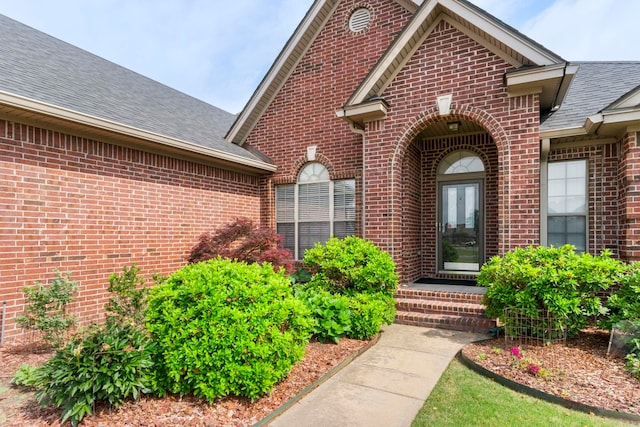 223 Maranes Cir, Maumelle, AR 72113 - property entrance featuring brick siding and a shingled roof