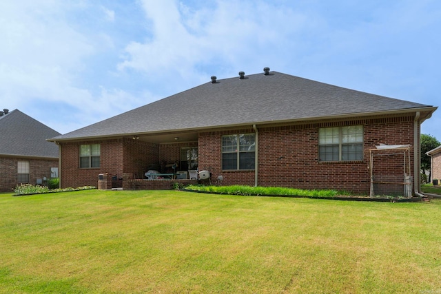 223 Maranes Cir, Maumelle, AR 72113 - rear view of house with a lawn, brick siding, and a shingled roof