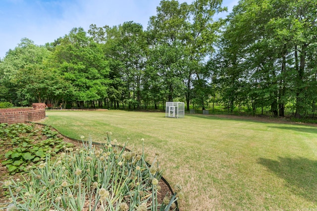 223 Maranes Cir, Maumelle, AR 72113 - view of grassy yard with view of scattered trees