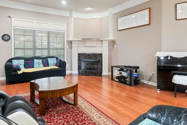 223 Maranes Cir, Maumelle, AR 72113 - living room featuring wood finished floors, baseboards, a high end fireplace, and ornamental molding
