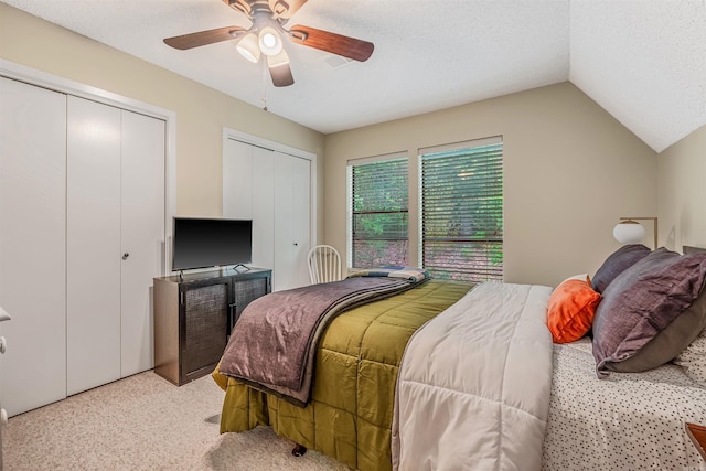 451 Forrest Dr, Heber Springs, AR 72543 - bedroom with two closets, light colored carpet, lofted ceiling, and ceiling fan