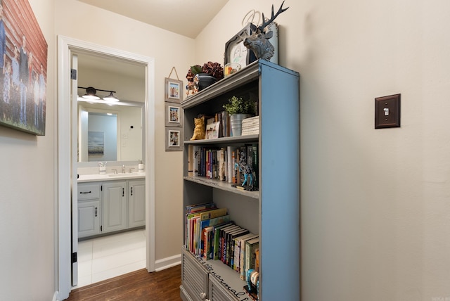 5623 Ridgeway Dr, Benton, AR 72019 - hall with a sink, dark wood-style flooring, and baseboards