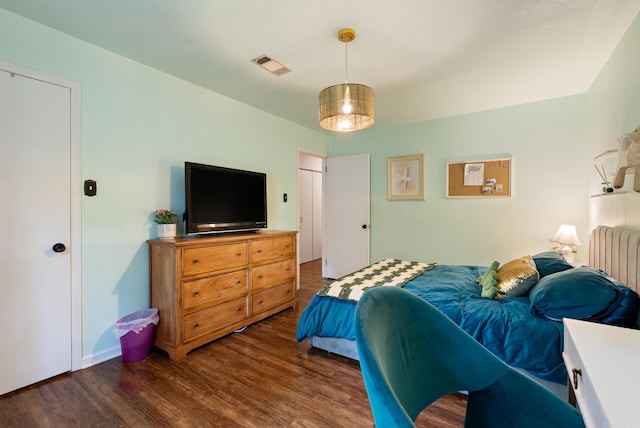 5623 Ridgeway Dr, Benton, AR 72019 - bedroom featuring wood finished floors and radiator